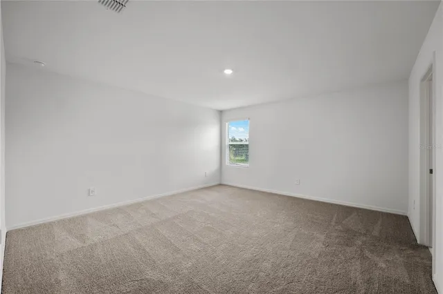 a bathroom with a double vanity sink mirror and shower