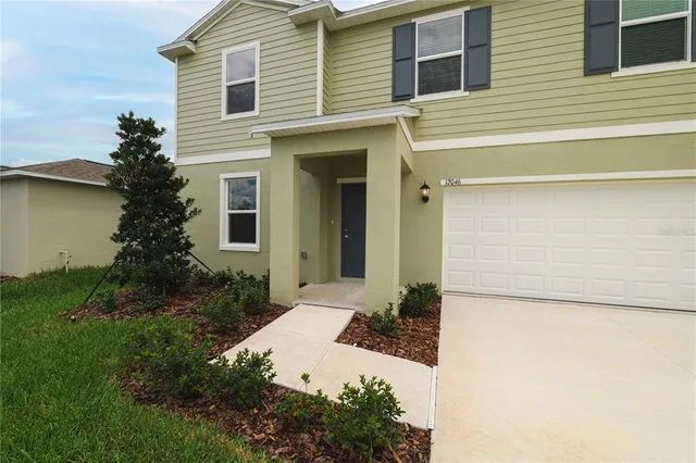 a view of yard with swimming pool and green space