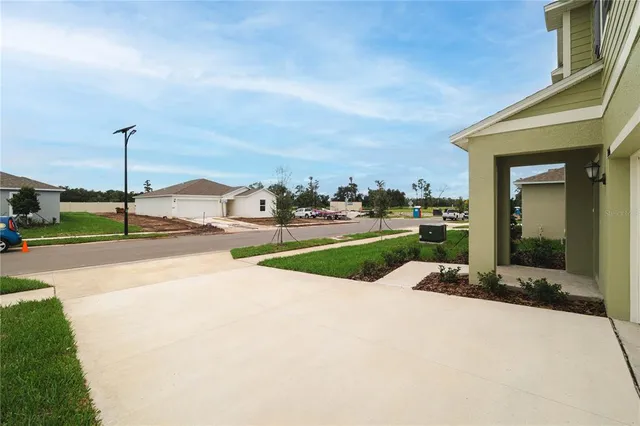 a view of an house with backyard space and garden