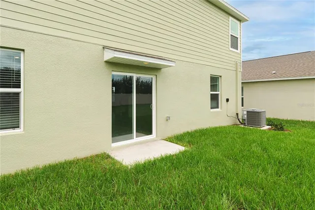 an aerial view of a house with garden space and outdoor space