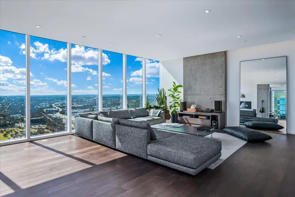 a living room with furniture and a large window