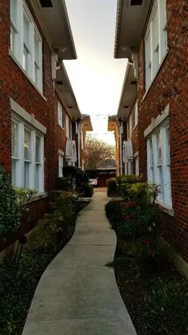 a view of a house next to a yard