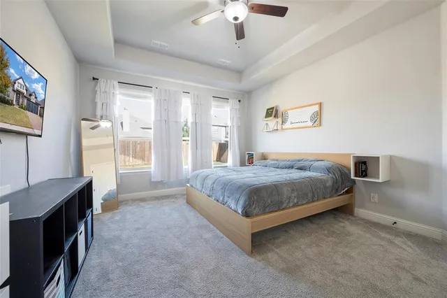 a bathroom with a double vanity sink mirror and bathtub