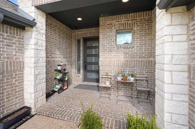 a large kitchen with kitchen island a sink a stove a refrigerator and cabinets