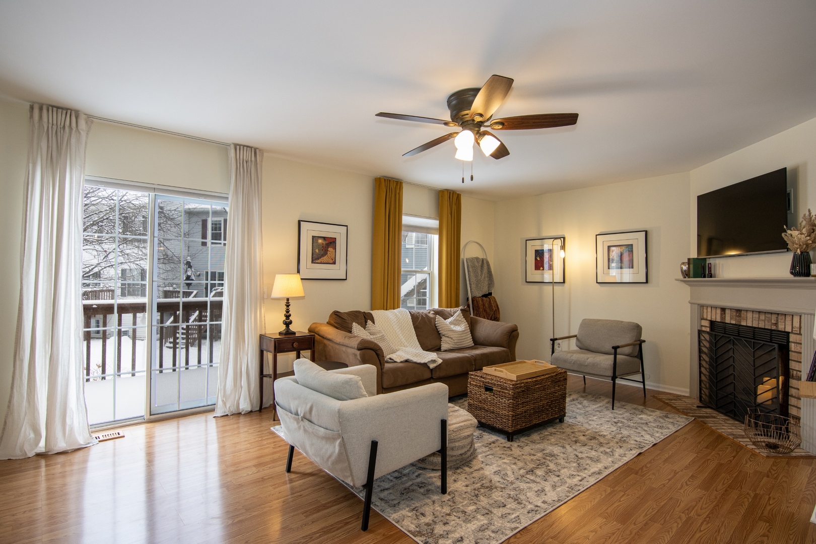 1213 Koster Court Geneva, IL 60134 - Photo 3 of 30 a living room with furniture a fireplace and a flat screen tv