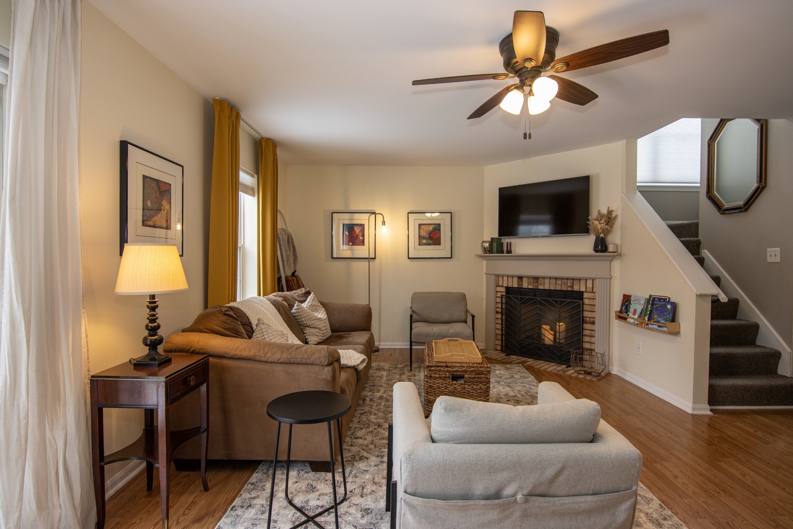 1213 Koster Court Geneva, IL 60134 - Photo 4 of 30 a living room with furniture a fireplace and a flat screen tv