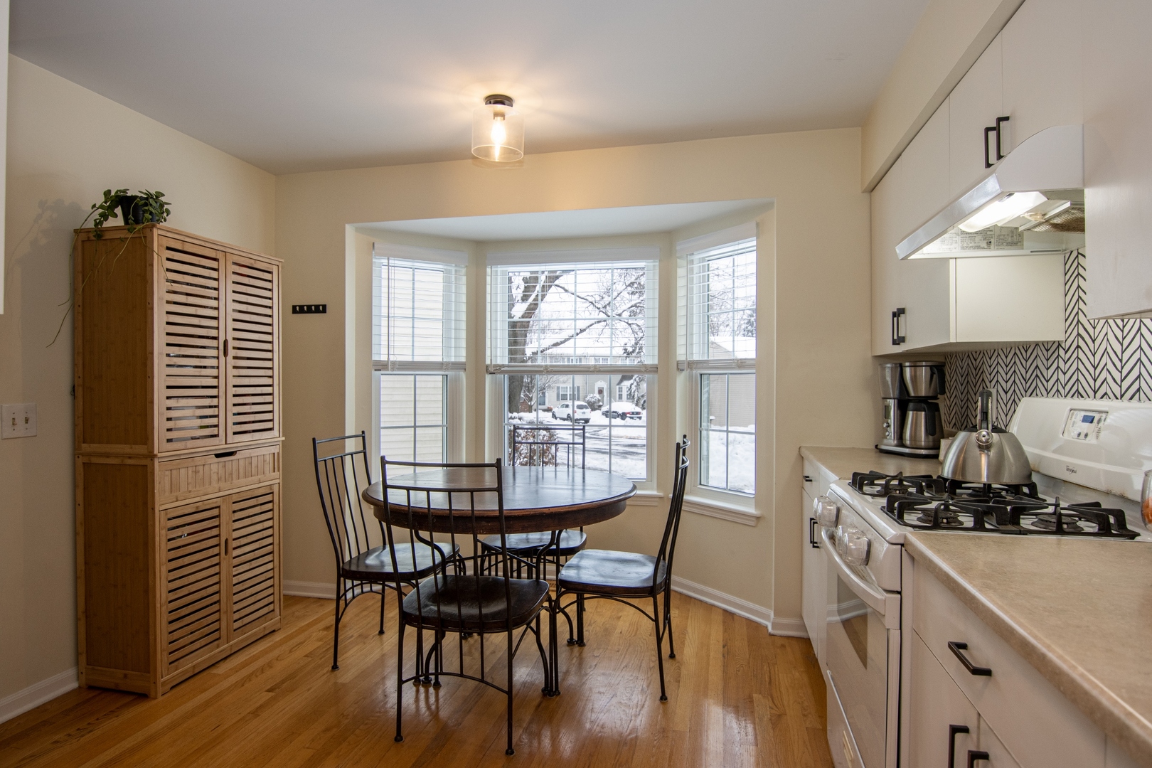 1213 Koster Court Geneva, IL 60134 - Photo 8 of 30 a view of a a dining room with furniture window and wooden floor
