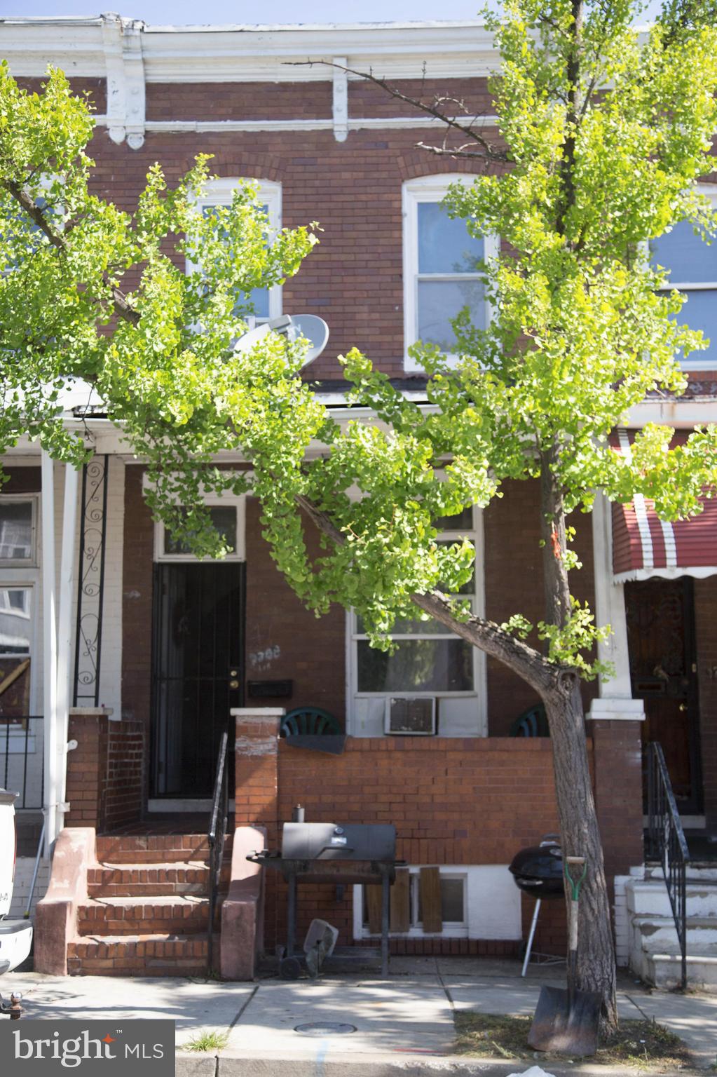 1708 Normal Avenue Baltimore, MD 21213 - Photo 1 of 18 a view of a patio with table and chairs and potted plants