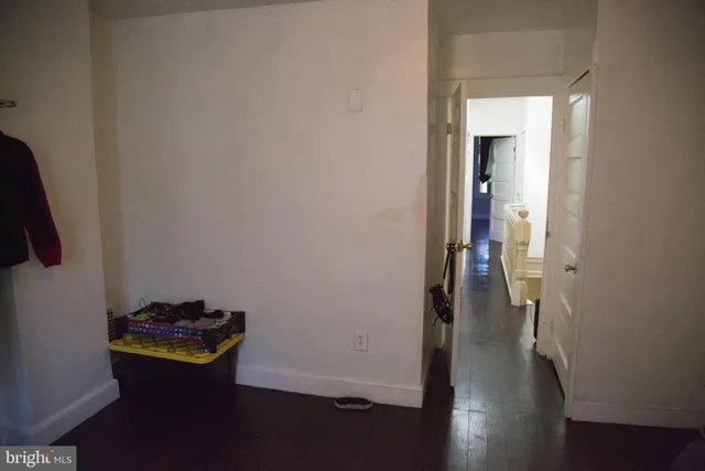 a room with wooden floor and shoes