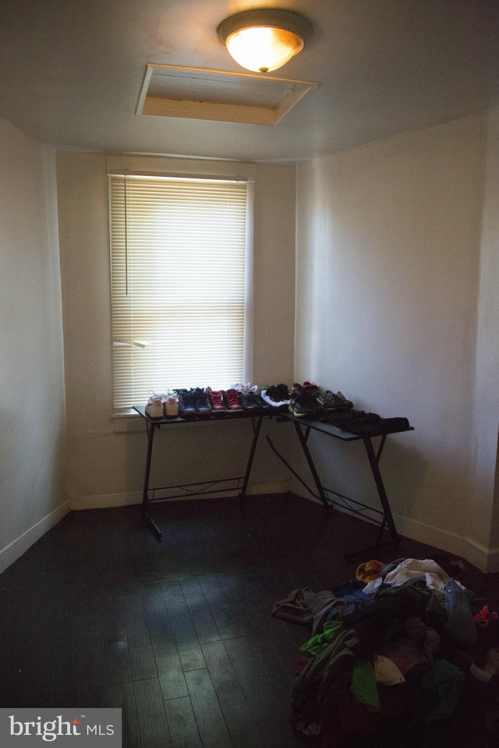 1708 Normal Avenue Baltimore, MD 21213 - Photo 12 of 18 a room with gym equipment and a window