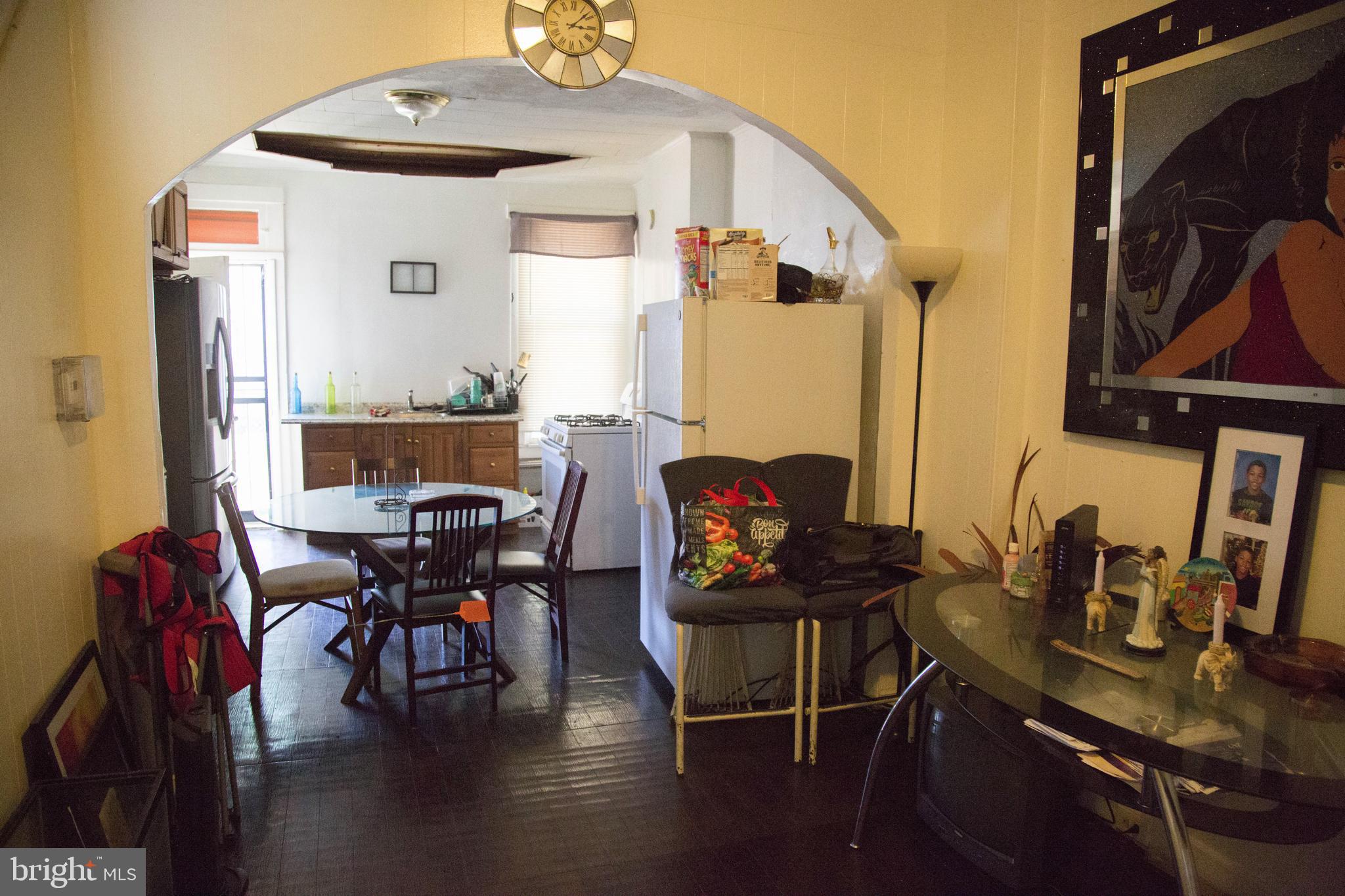 1708 Normal Avenue Baltimore, MD 21213 - Photo 2 of 18 a view of a dining room with furniture and wooden floor