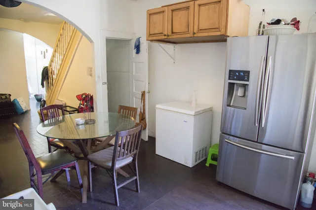 a kitchen with stainless steel appliances a refrigerator and a refrigerator