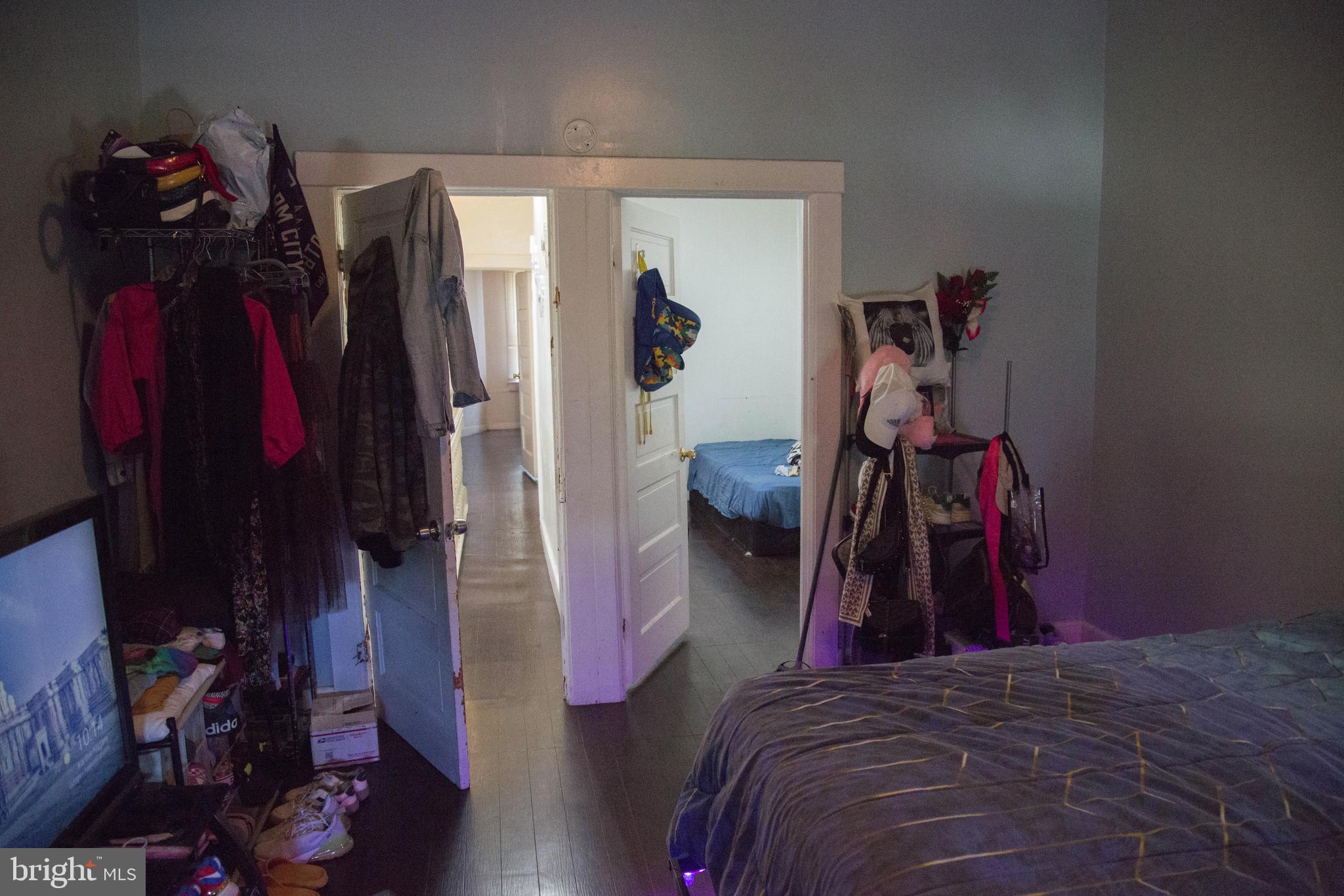 1708 Normal Avenue Baltimore, MD 21213 - Photo 5 of 18 a bed room with a bed and a closet