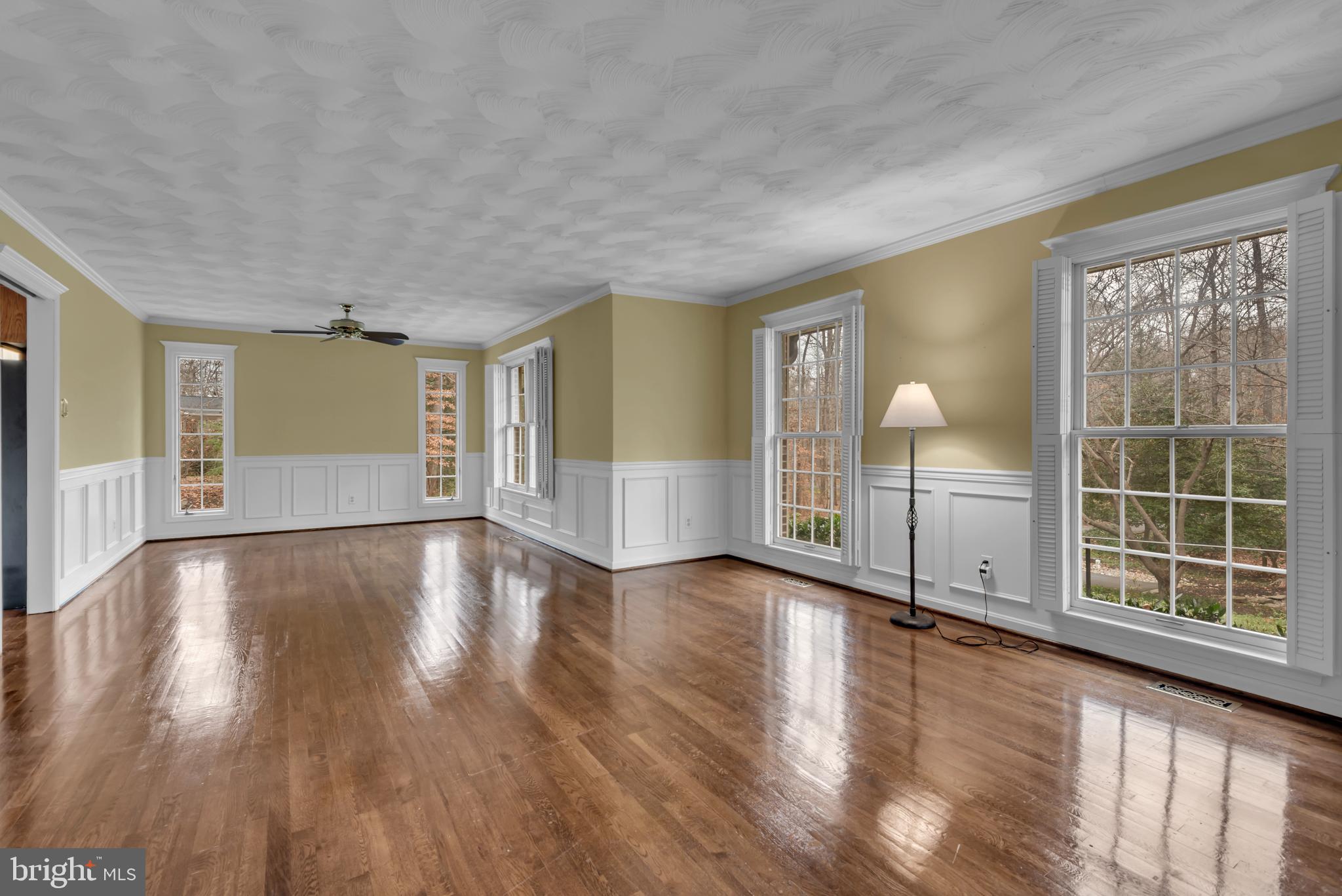 671 Discovery Court Davidsonville, MD 21035 - Photo 12 of 71 an empty room with wooden floor and windows