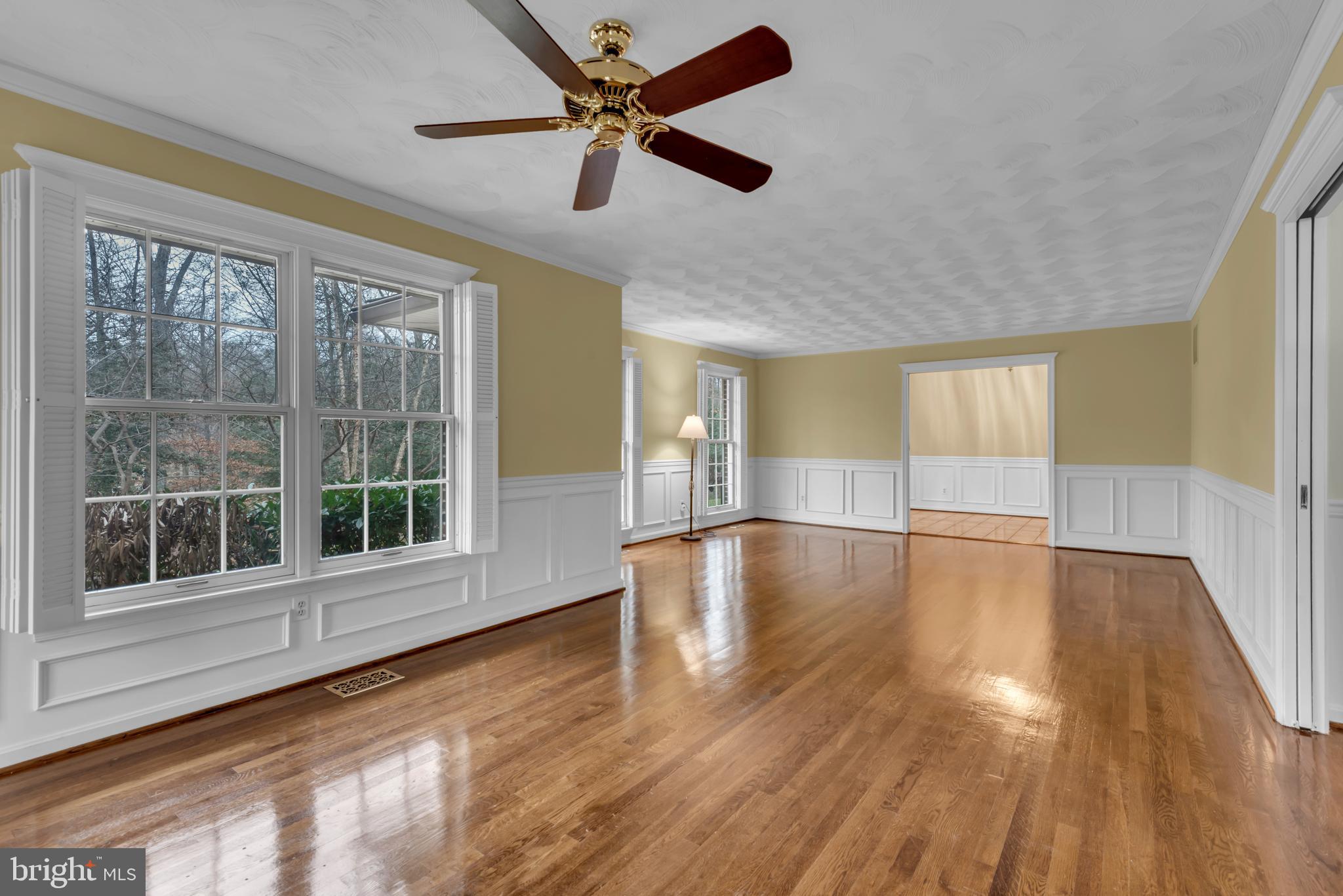 671 Discovery Court Davidsonville, MD 21035 - Photo 14 of 71 a view of empty room with wooden floor and fan