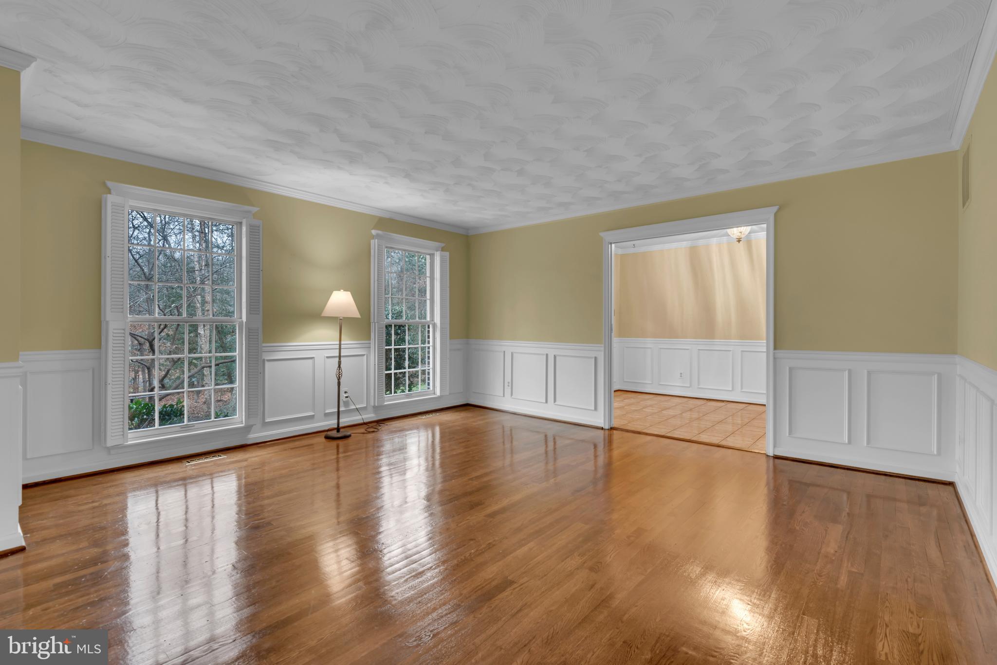 671 Discovery Court Davidsonville, MD 21035 - Photo 15 of 71 a view of empty room with wooden floor and fan