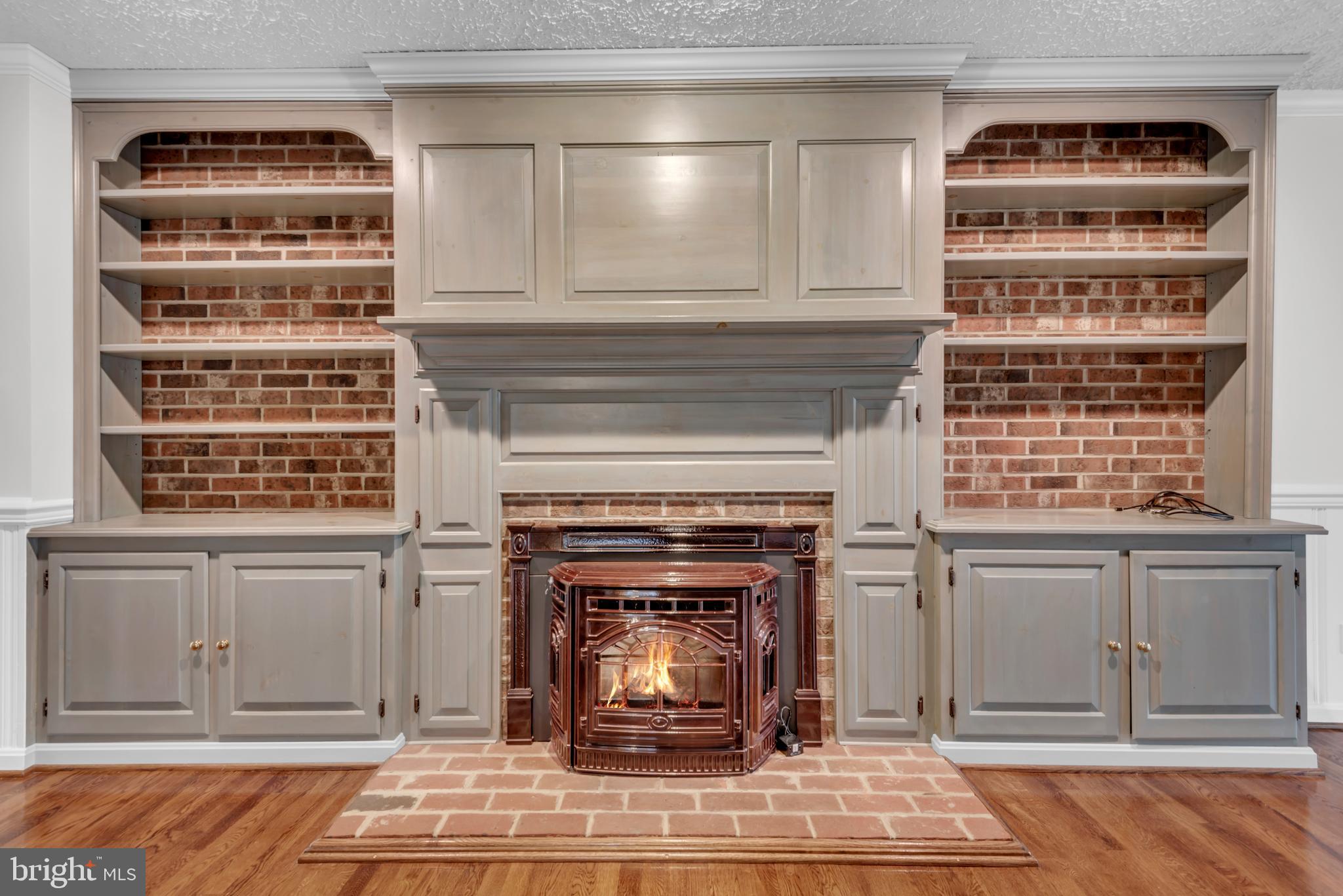 671 Discovery Court Davidsonville, MD 21035 - Photo 19 of 71 Custom Built-In's w Mantle & Brick Accent Wall
