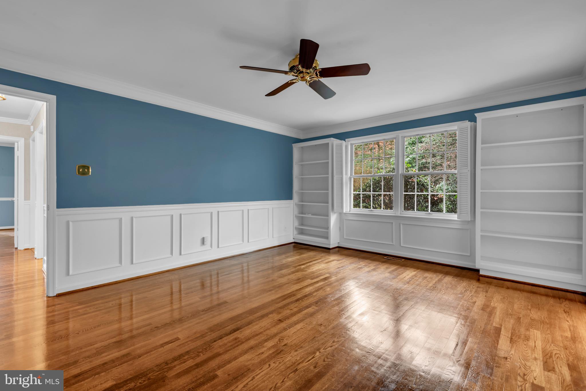 671 Discovery Court Davidsonville, MD 21035 - Photo 43 of 71 a view of empty room with wooden floor and fan