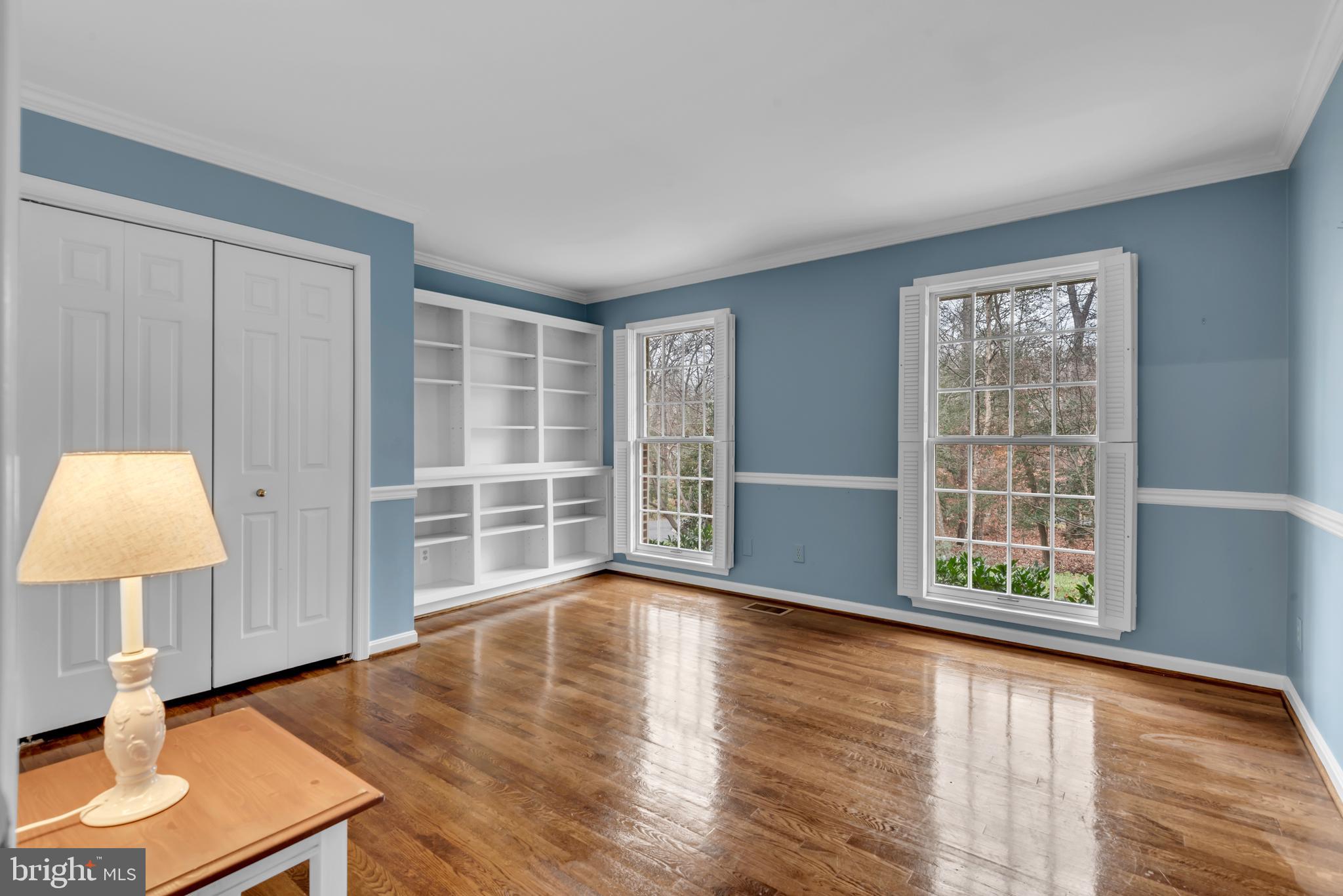 671 Discovery Court Davidsonville, MD 21035 - Photo 47 of 71 a view of an empty room with window and wooden floor