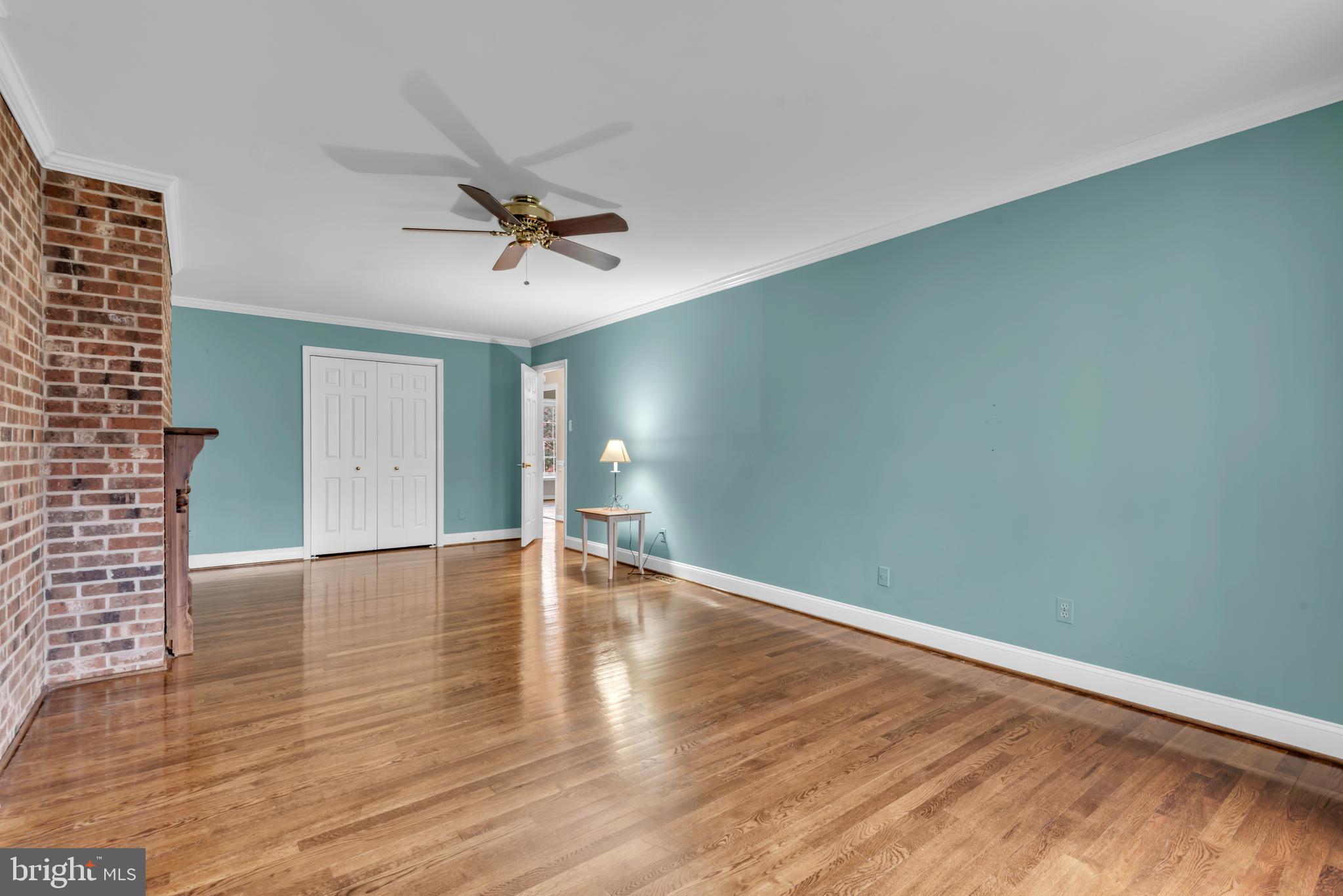 671 Discovery Court Davidsonville, MD 21035 - Photo 50 of 71 a view of empty room with wooden floor and fan