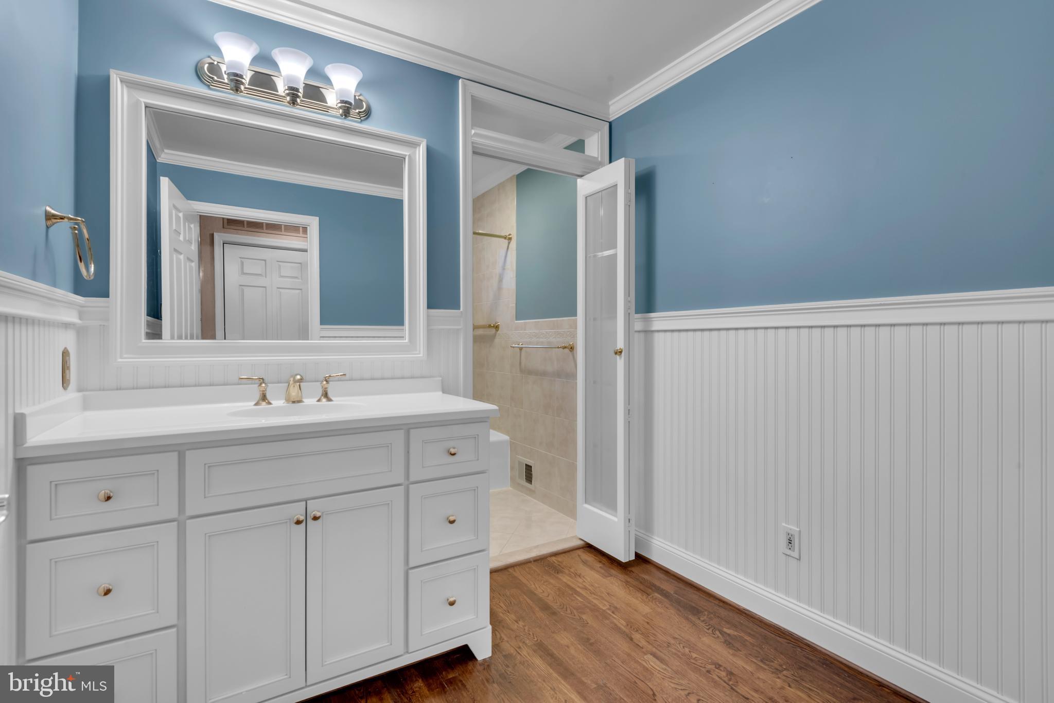 671 Discovery Court Davidsonville, MD 21035 - Photo 53 of 71 a bathroom with a sink and a mirror