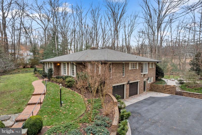 671 Discovery Court Davidsonville, MD 21035 - Photo 6 of 71 a front view of house with yard and trees in the background