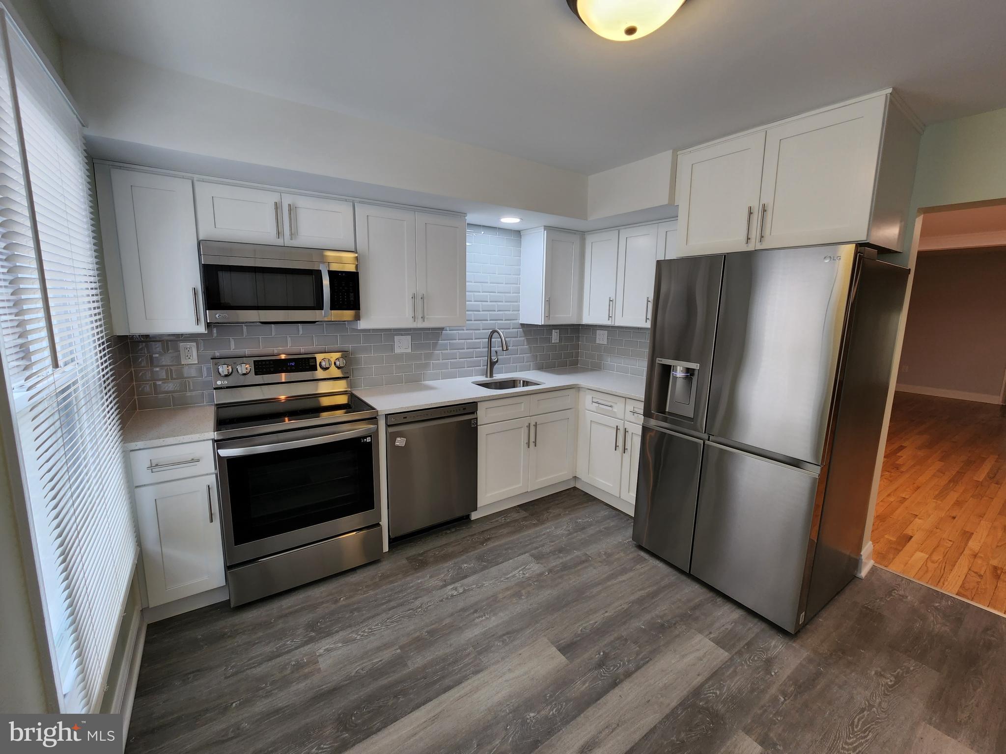 29 Providence Avenue Doylestown, PA 18901 - Photo 3 of 12 a kitchen with a refrigerator stove and a sink