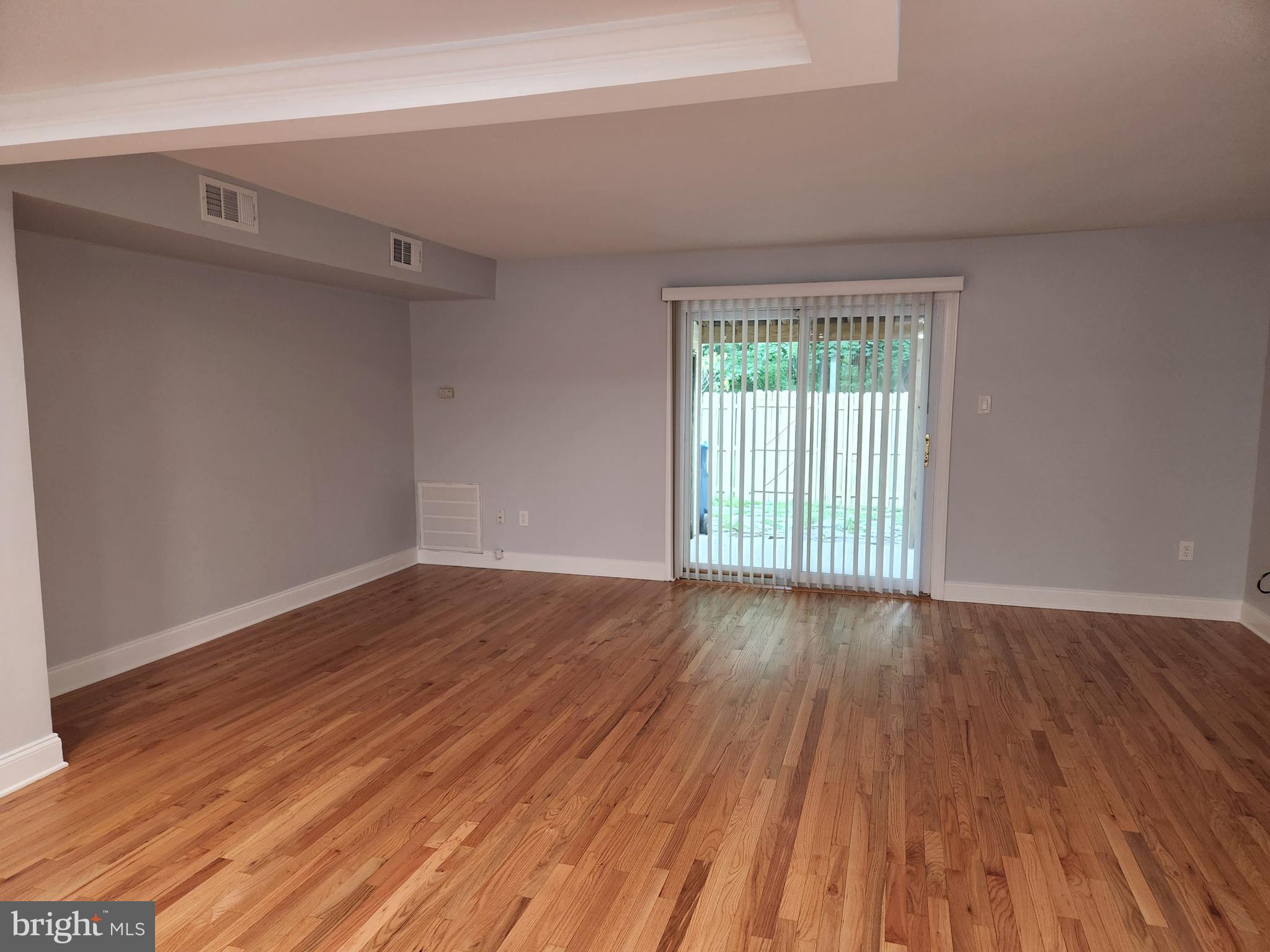 29 Providence Avenue Doylestown, PA 18901 - Photo 5 of 12 a view of an empty room with wooden floor and a window