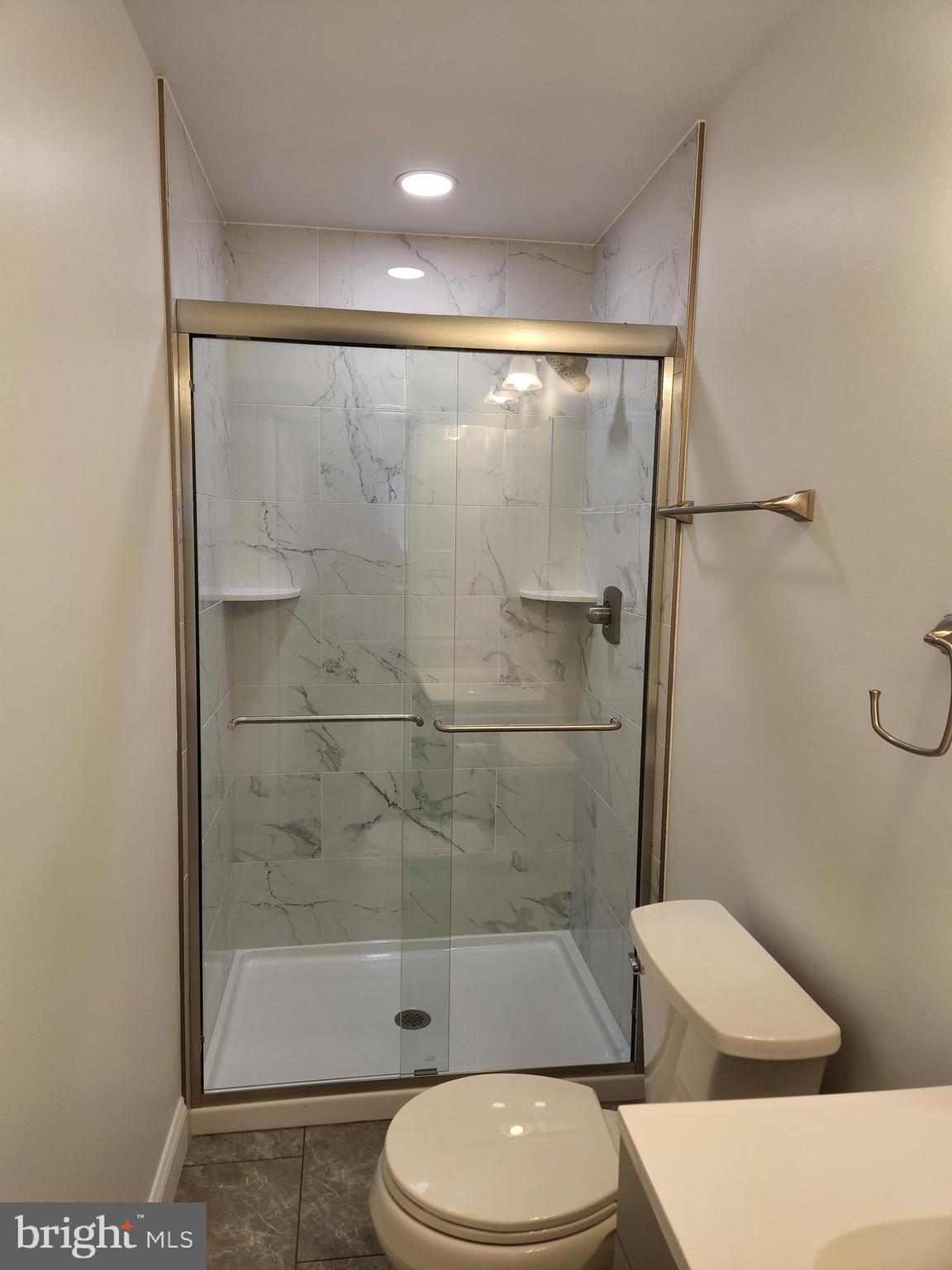 29 Providence Avenue Doylestown, PA 18901 - Photo 7 of 12 a bathroom with a toilet and a shower