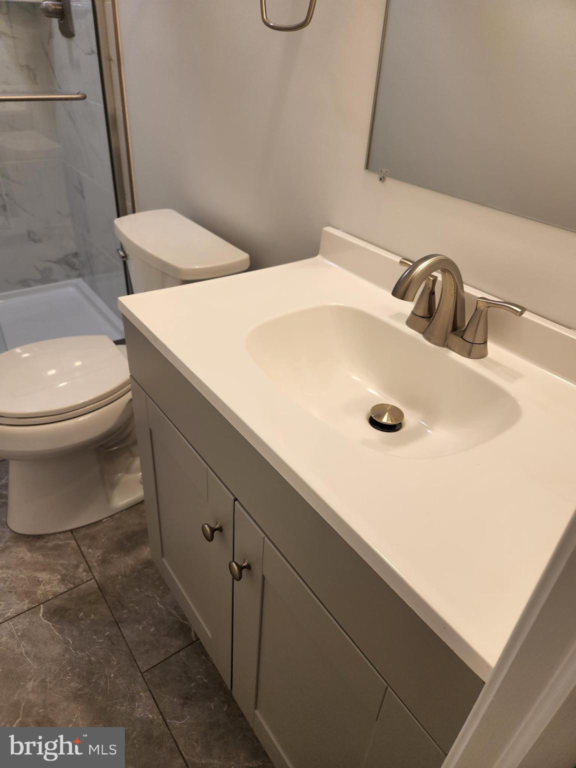 29 Providence Avenue Doylestown, PA 18901 - Photo 8 of 12 a bathroom with a sink a toilet and mirror