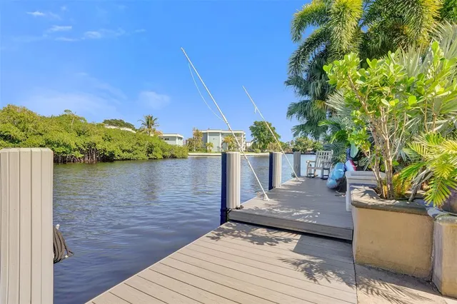 a view of a terrace with a garden and covered with wooden fence