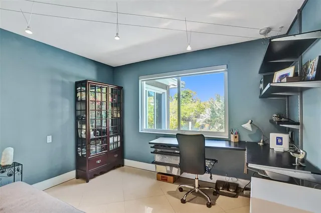 a workspace with furniture hardwood and a window