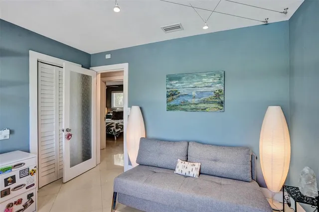 a room with a bed and a mirror