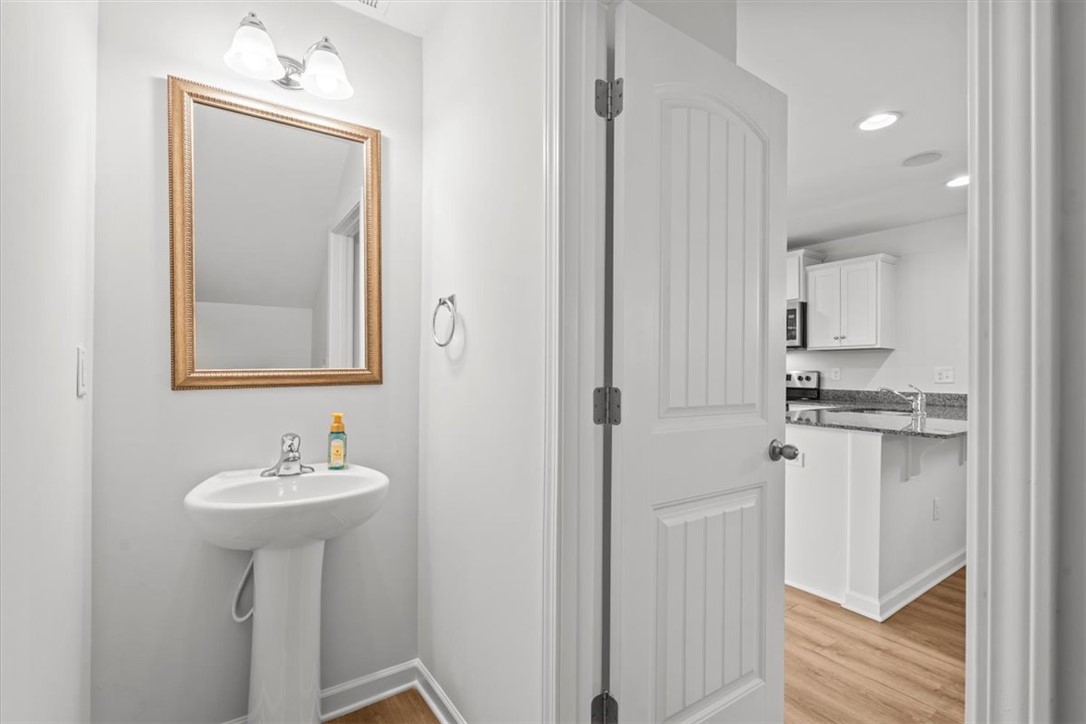 118 Adger Road Pendleton, SC 29670 - Photo 6 of 31 This functional bathroom with a pedestal sink offers convenience and style.