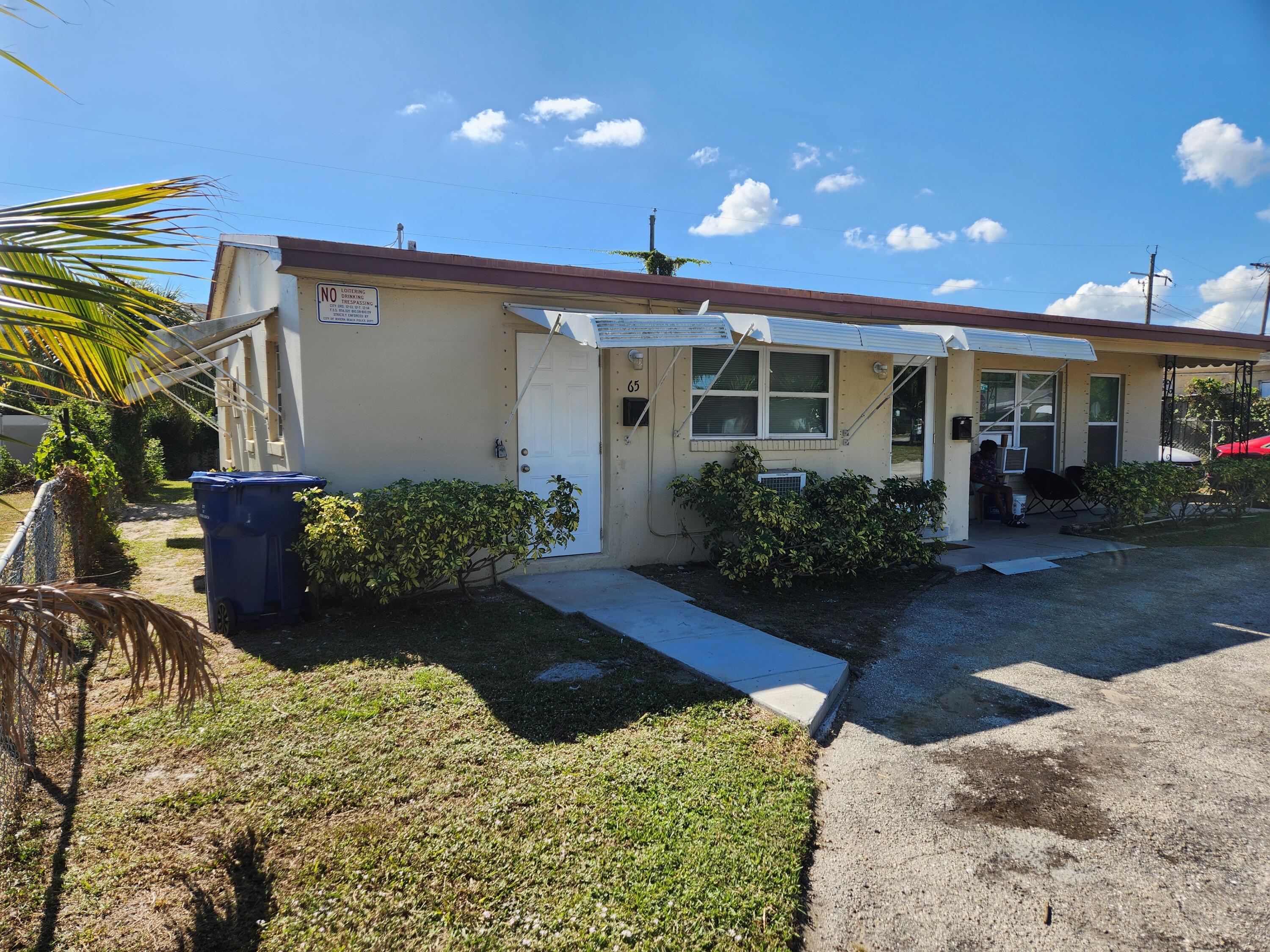 65 West 34th Street, Unit A Riviera Beach, FL 33404 - Photo 13 of 17 front view of a house with a yard