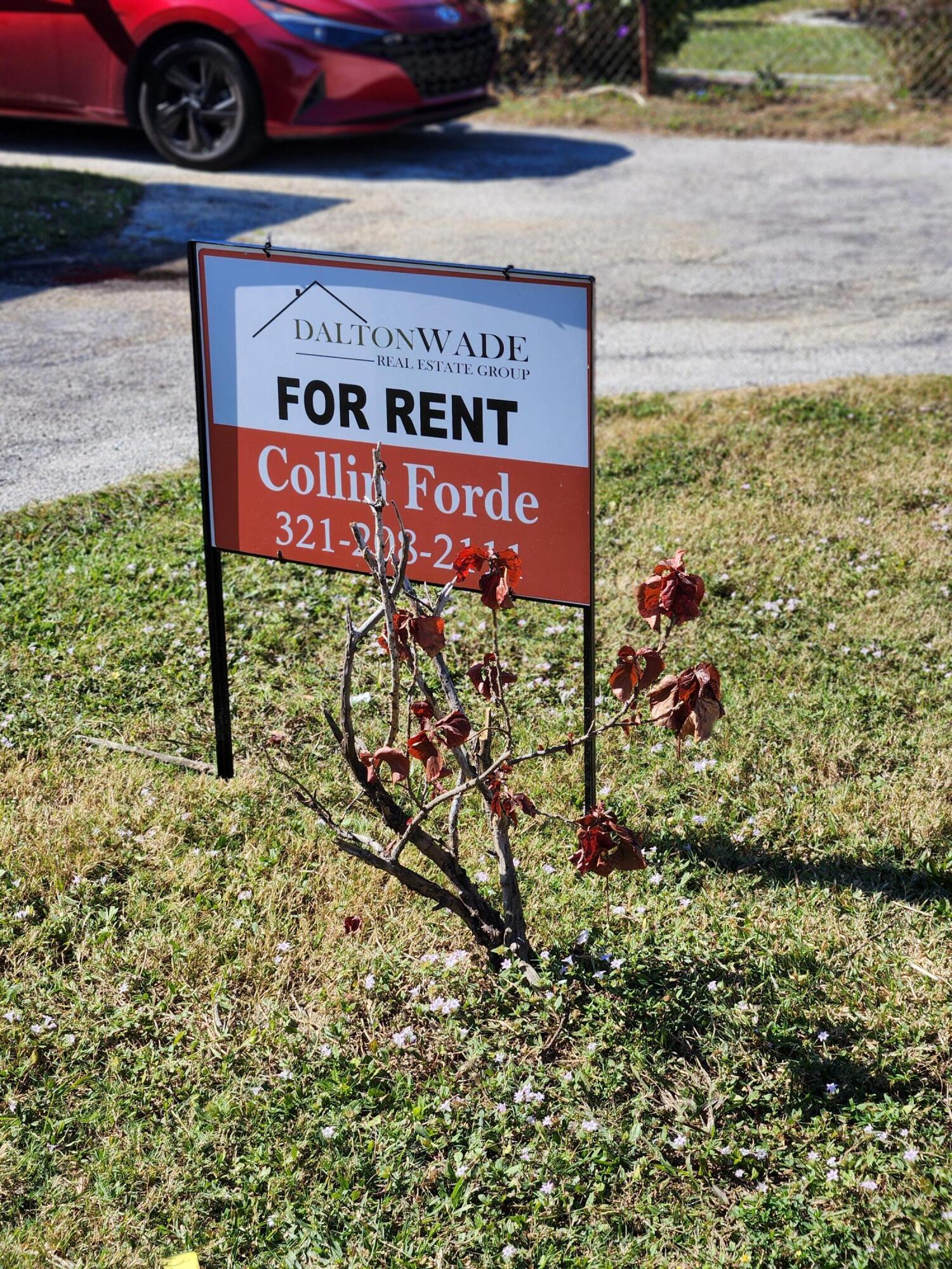 65 West 34th Street, Unit A Riviera Beach, FL 33404 - Photo 2 of 17 a sign on the side of a building