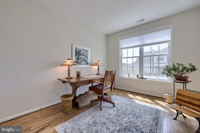 a kitchen with cabinets appliances a sink and a window