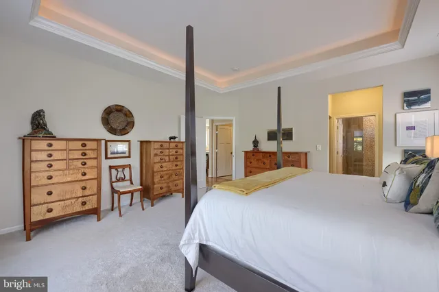 a bathroom with a granite countertop sink toilet and a mirror