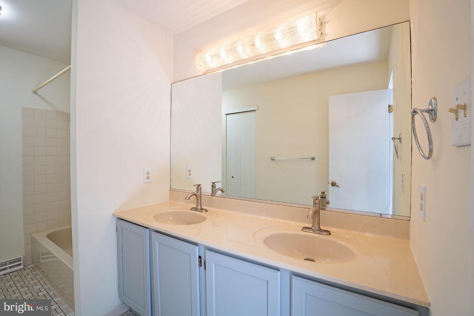 491 Kings Road Yardley, PA 19067 - Photo 32 of 52 a bathroom with a sink and a mirror