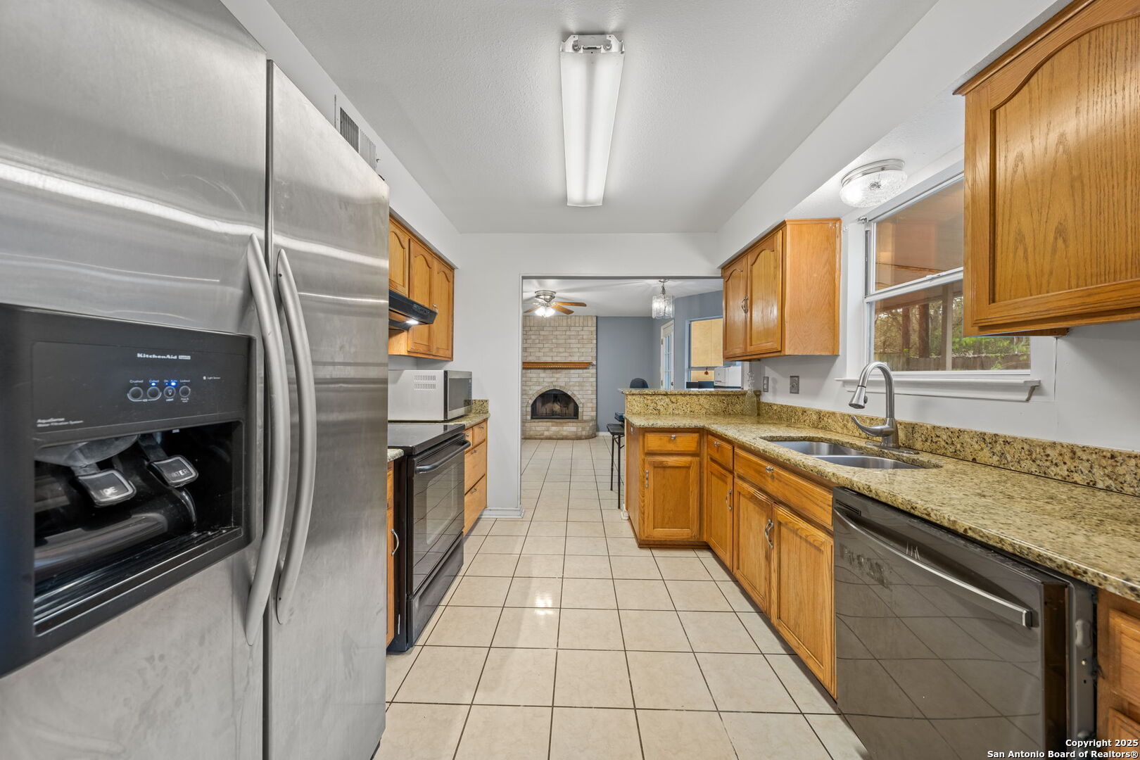105 Golden Way Universal City, TX 78148 - Photo 15 of 23 a kitchen with stainless steel appliances granite countertop a sink and cabinets