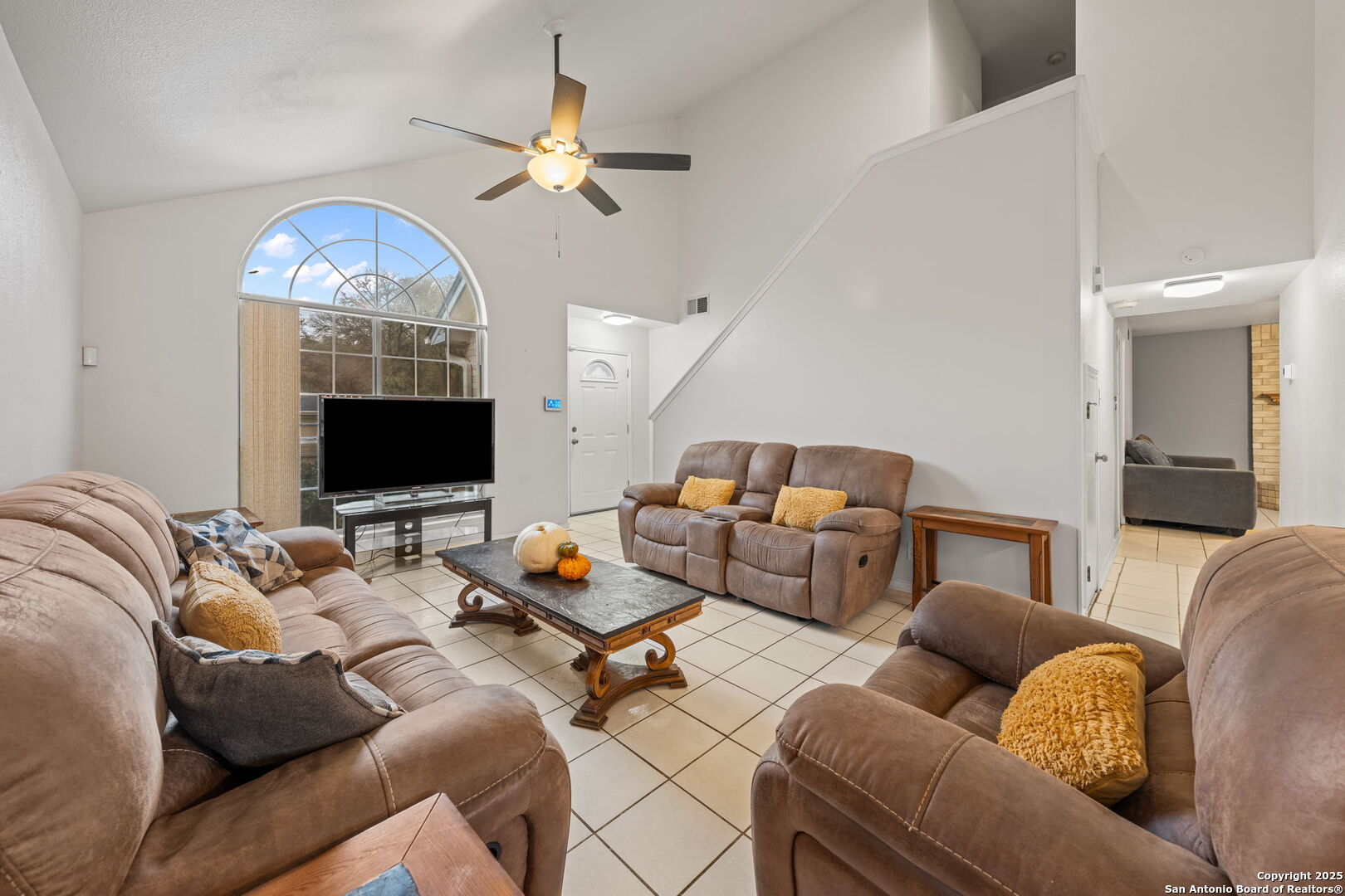 105 Golden Way Universal City, TX 78148 - Photo 10 of 23 a living room with furniture a flat screen tv and a fireplace