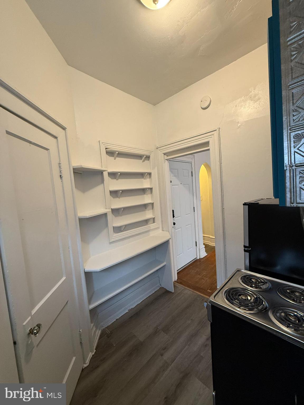 210 West State Street, Unit 3 Trenton, NJ 08608 - Photo 5 of 11 a room with furniture and a flat screen tv