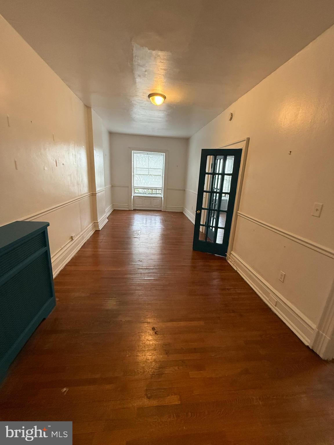 210 West State Street, Unit 3 Trenton, NJ 08608 - Photo 6 of 11 a view of an empty room with window and wooden floor