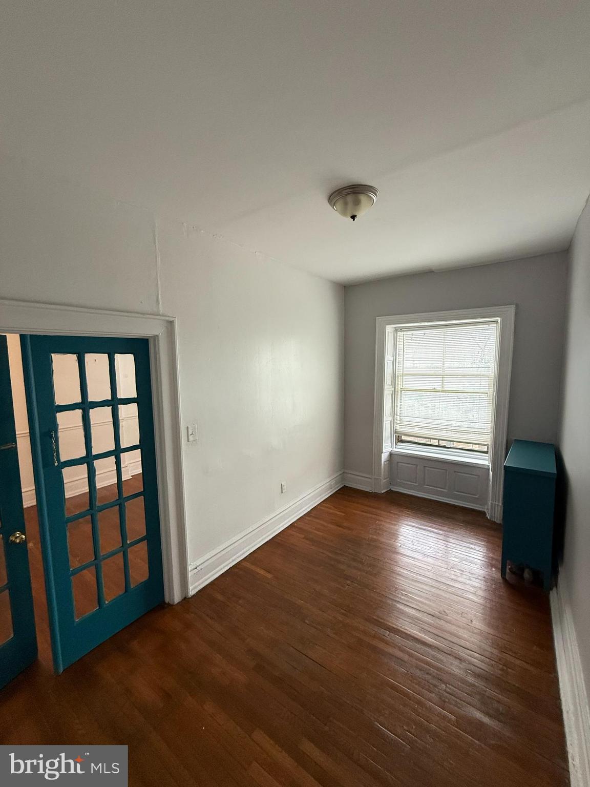 210 West State Street, Unit 3 Trenton, NJ 08608 - Photo 8 of 11 an empty room with wooden floor and windows