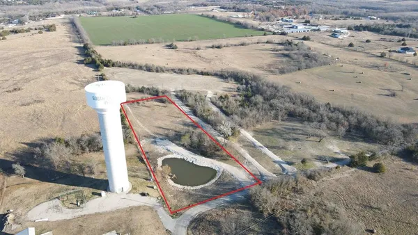 a bird view of a house with a yard