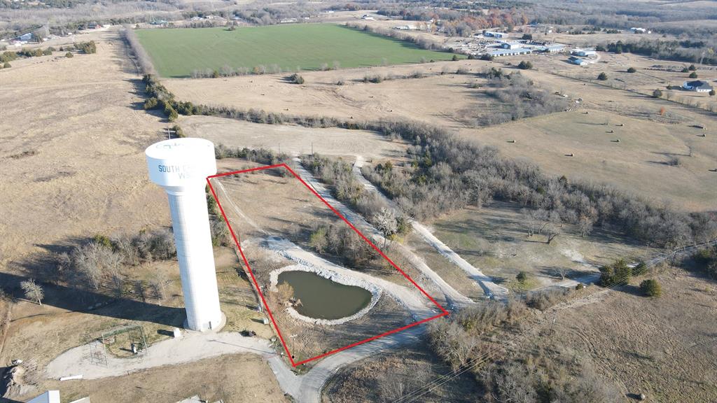 a bird view of a house with a yard