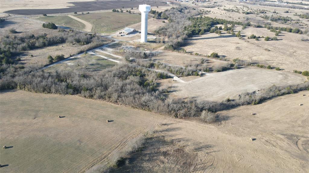 239 Bh Cooke Lane Van Alstyne, TX 75495 - Photo 4 of 6 a view of dirt road with a building