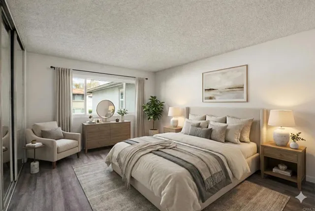 a spacious bedroom with a bed and a couch