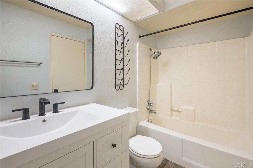 9829 Caspi Gardens Drive, Unit 6 Santee, CA 92071 - Photo 14 of 23 a bathroom with a sink a toilet and shower