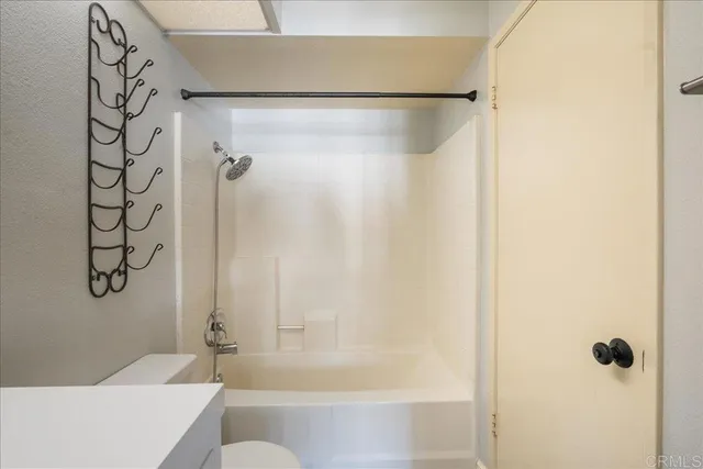 a bathroom with a shower and a bath tub